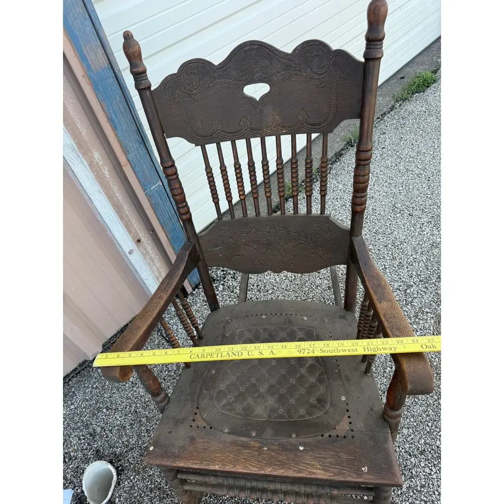 Antique Spindle Rocking Chair With Carvings and Cutout accent